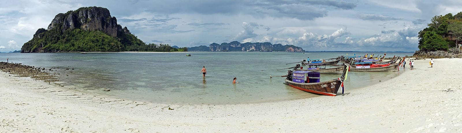 The low-tide sandbar between Tup Island and Chicken Island, with longtails in the shallows