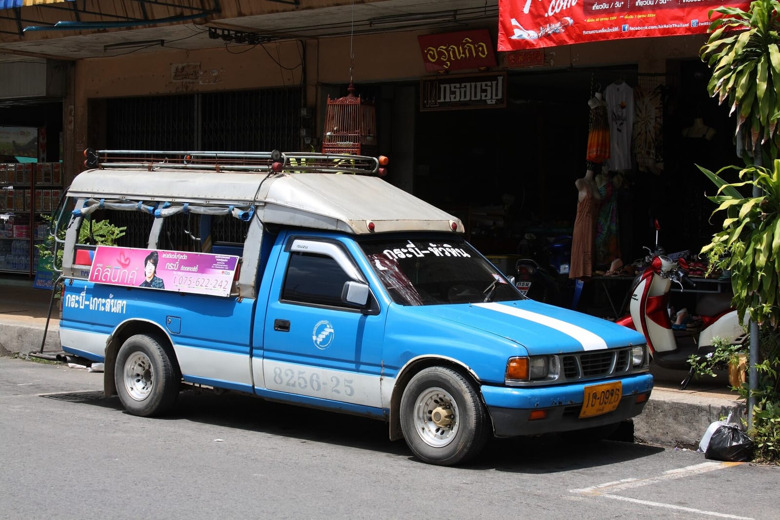 A songthaew pickup on a Krabi street, the shared ride between Ao Nang and Krabi Town