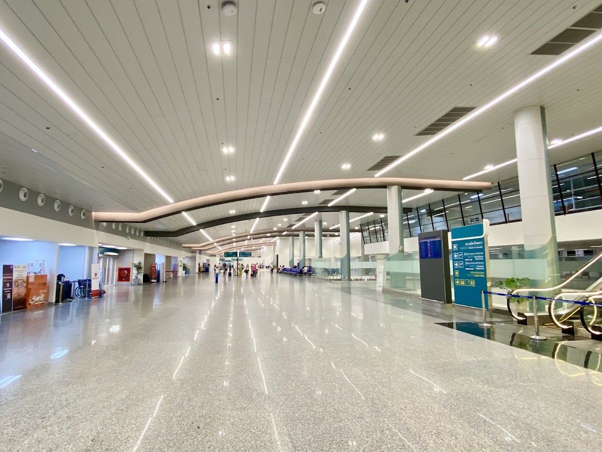 The arrivals hall of Krabi International Airport (KBV), a modern terminal with high ceilings and information desks